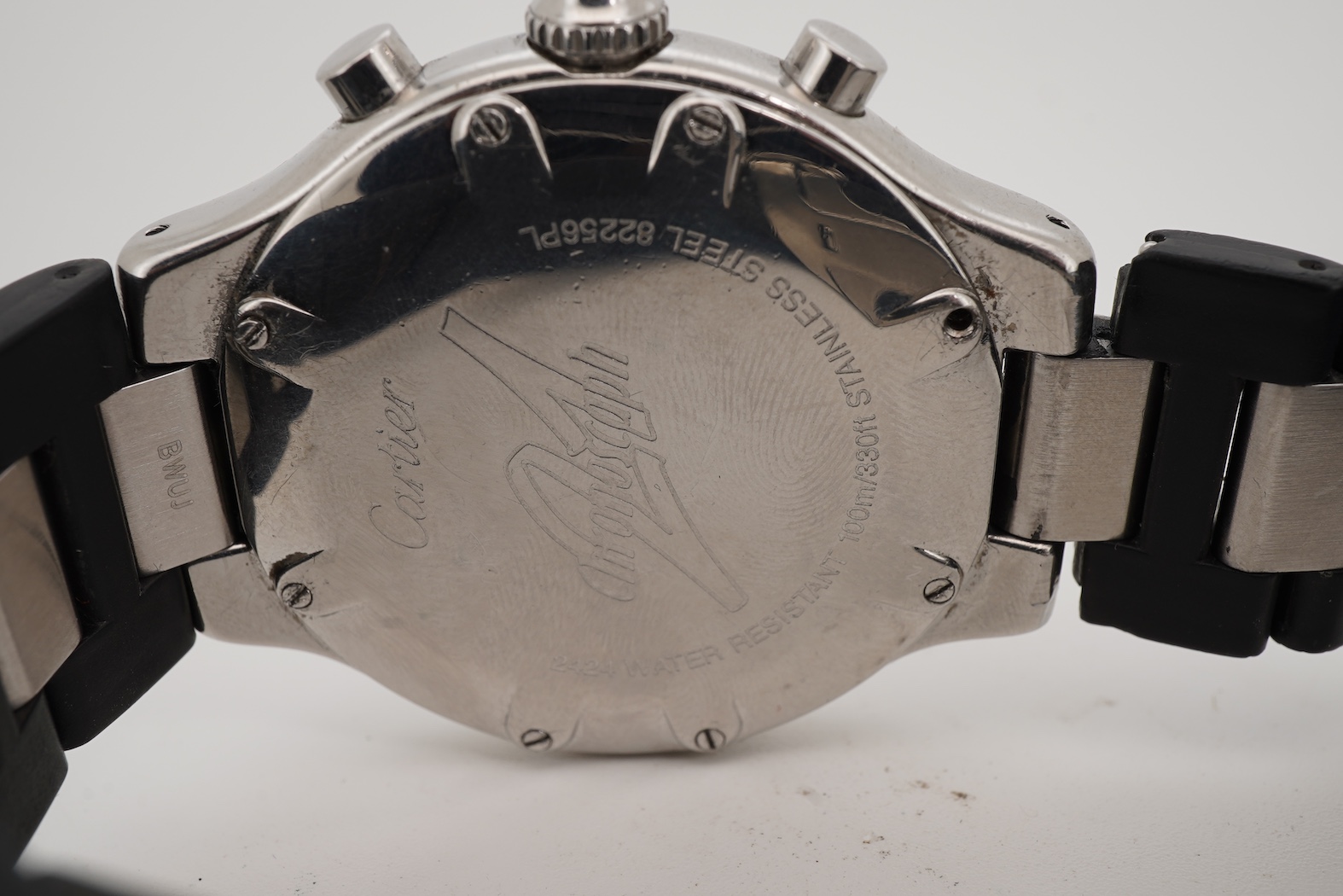 A gentleman's stainless steel Cartier 21 Chronoscaph wrist watch, the black face with three subsidiary dials, date aperture and baton numerals